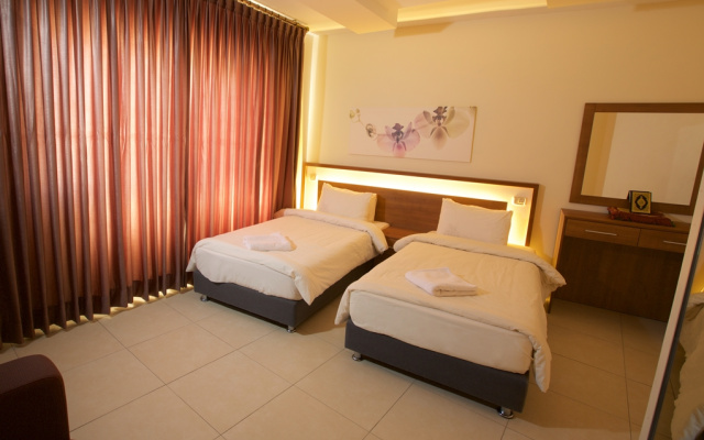 Отель Lujain Suites
