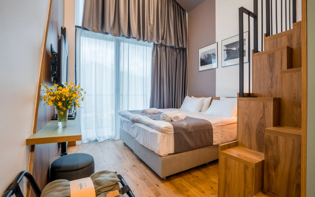 Quadruple Suite with balcony and with mountain view · Step Inn - Kazbegi Boutique-Hotel — photo 1