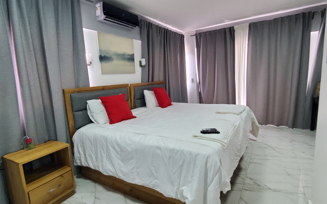 Отель Boca Grande Suites