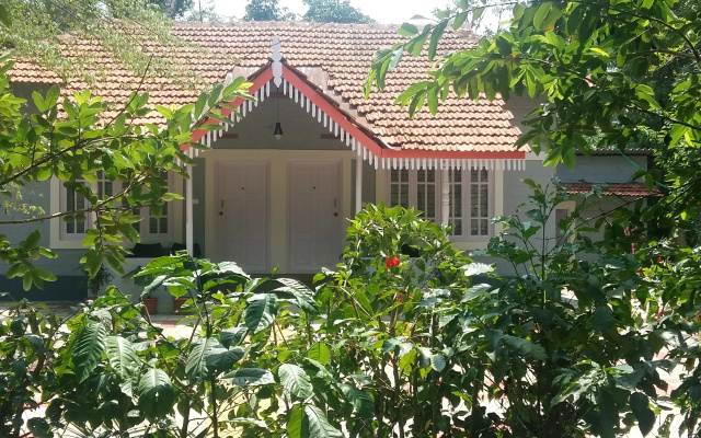 Отель Whispering woods coorg