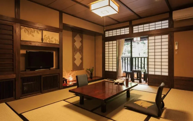 Отель Sanga Ryokan Минамиогуни комната для гостей