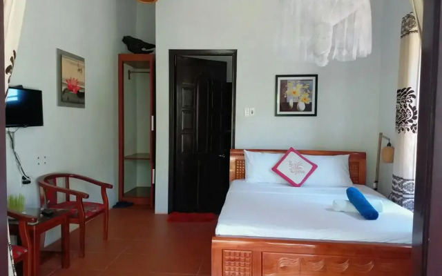 Отель Dragon Sea Homestay Хойан комната для гостей
