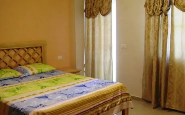 Отель Apartamentos En Boca Chica Mama Jo Доминикана, Бока Чика - отзывы, цены и фото номеров - забронировать отель Apartamentos En Boca Chica Mama Jo онлайн комната для гостей