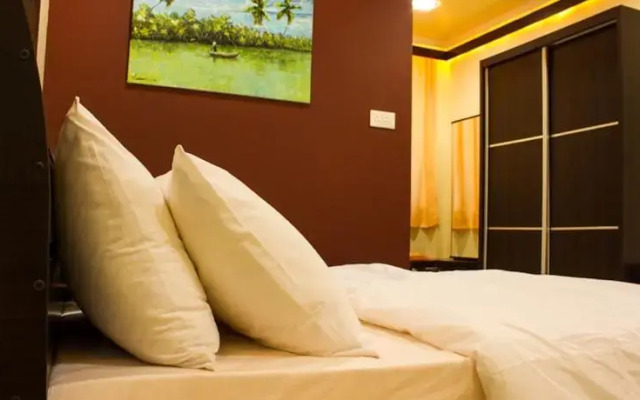 Отель Beverly Park Inn Мале комната для гостей