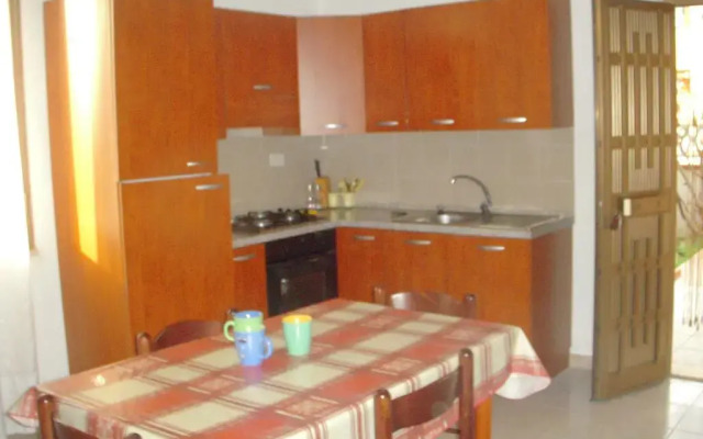 Отель Appartamento La Caletta Синискола в номере