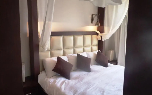 Апартаменты Sunset Pearl Apartments комната для гостей