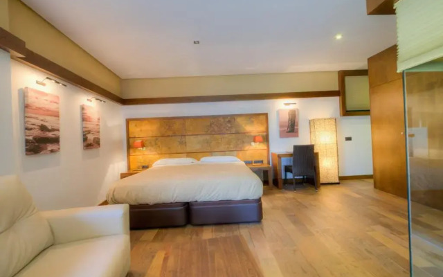 Отель Apartamentos El Roqueo комната для гостей