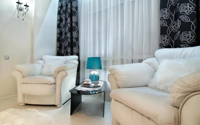 Апартаменты EuApartments в центре города комната для гостей