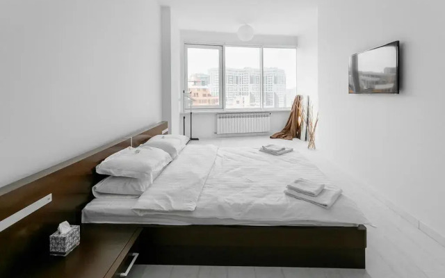 Апартаменты At Home Apartment комната для гостей
