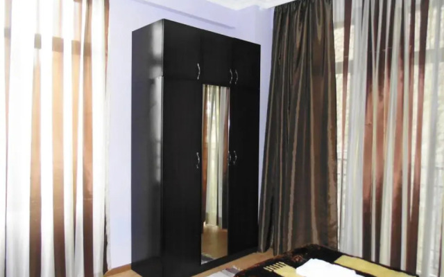 Апартаменты Welcome Inn комната для гостей