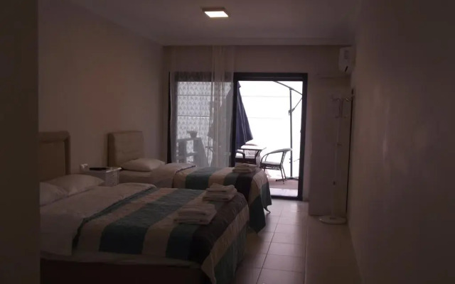 Отель Saatli Suites Чешме комната для гостей