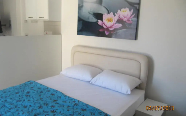 Апартаменты Sunny Holiday Apartments комната для гостей