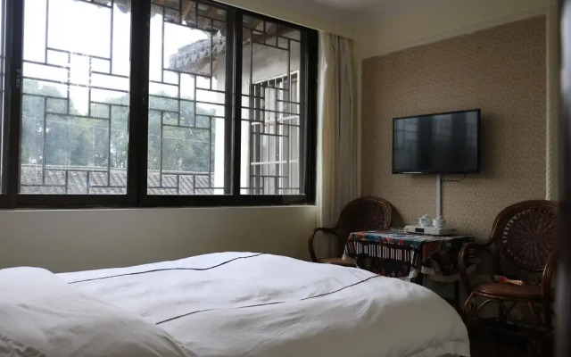 Отель Zhou Zhuang Zhen Feng Inn комната для гостей